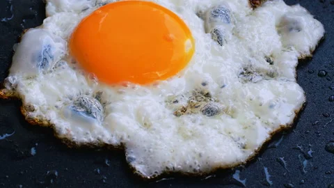 Egg frying Stock Footage 144040643