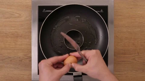 Egg in a frying pan. Cooking process. top plan. Part 1 Video stock 164037690