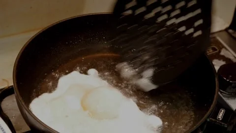 Egg Frying in Pan: Cooking Process with Sizzling Sound Stock Footage 328865102