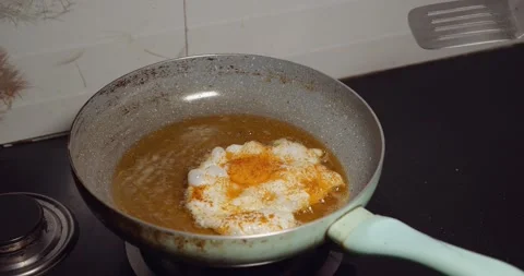 Egg frying in a pan Stock Footage 132708268