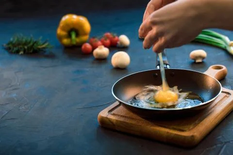 Egg on the frying pan Stock Photos