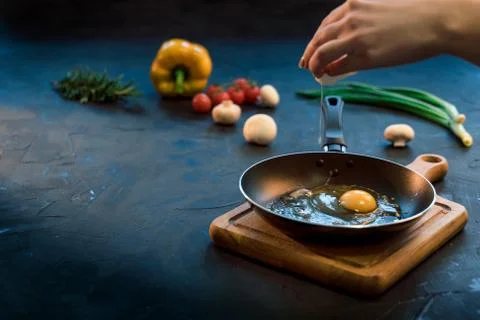 Egg on the frying pan Stock Photos