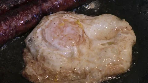 Egg frying in the pan/skillet Stock Footage 46000740