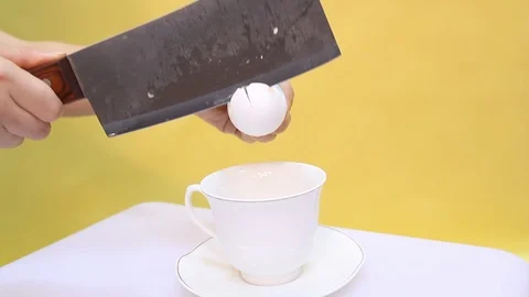 Egg in a glass on a yellow background Stock Footage 103186602