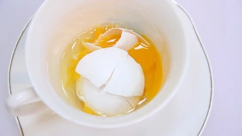 Egg in a glass on a yellow background Stock Footage 103186625