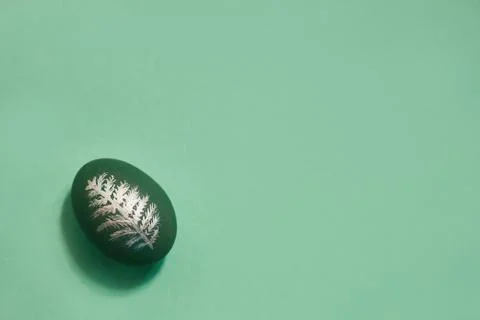 Egg on a green background with copy space. Top view Stock Photos