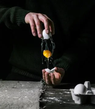 Egg in hands Stock Photos