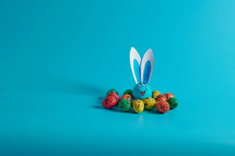 Egg with hare ears and easter eggs Stock Photos