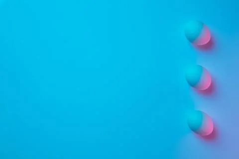 Egg hunt is coming. Easter traditions, neon colored eggs, top view Stock Photos