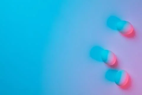 Egg hunt is coming. Easter traditions, neon colored eggs, top view Stock Photos