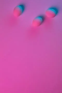 Egg hunt is coming. Easter traditions, neon colored eggs, top view Stock Photos