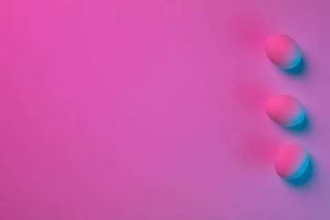 Egg hunt is coming. Easter traditions, neon colored eggs, top view Stock Photos