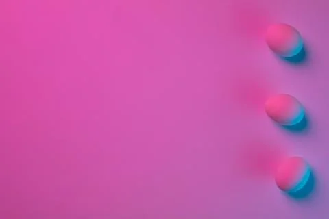 Egg hunt is coming. Easter traditions, neon colored eggs, top view Stock Photos