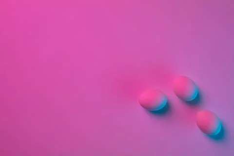 Egg hunt is coming. Easter traditions, neon colored eggs, top view Stock Photos