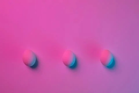 Egg hunt is coming. Easter traditions, neon colored eggs, top view Stock Photos