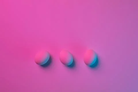 Egg hunt is coming. Easter traditions, neon colored eggs, top view Stock Photos