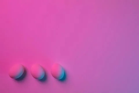 Egg hunt is coming. Easter traditions, neon colored eggs, top view Stock Photos