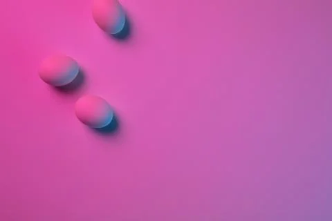 Egg hunt is coming. Easter traditions, neon colored eggs, top view Stock Photos