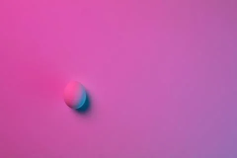 Egg hunt is coming. Easter traditions, neon colored eggs, top view Stock Photos