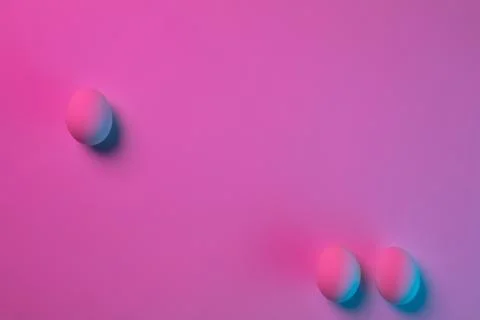 Egg hunt is coming. Easter traditions, neon colored eggs, top view Stock Photos