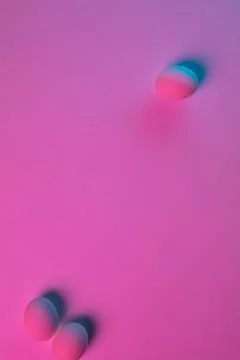 Egg hunt is coming. Easter traditions, neon colored eggs, top view Stock Photos