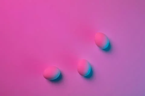 Egg hunt is coming. Easter traditions, neon colored eggs, top view Stock Photos