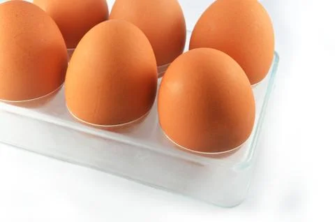 Egg isolated / six eggs in box isolated on white background - fresh brown egg Foto stock