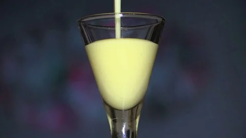 Egg liqueur on a colorful background closeup 스톡 동영상 80728292