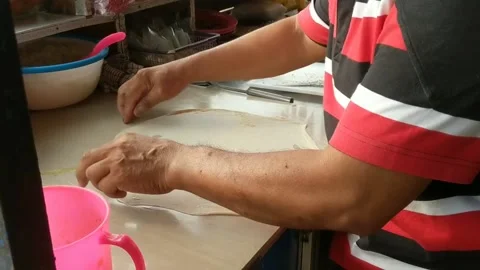 Egg martabak dough Stock Footage 229447871