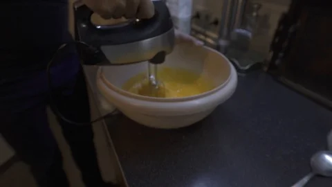 Egg mixing in bowl Stock Footage 127093937