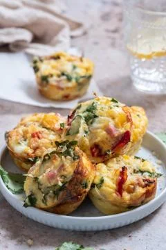 Egg muffins with ham, cheese and vegetables Stock Photos