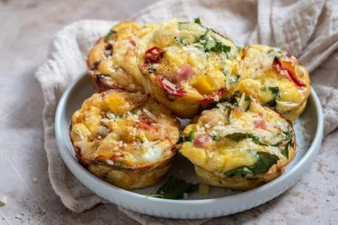 Egg muffins with ham, cheese and vegetables Stock Photos