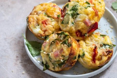 Egg muffins with ham, cheese and vegetables Stock Photos