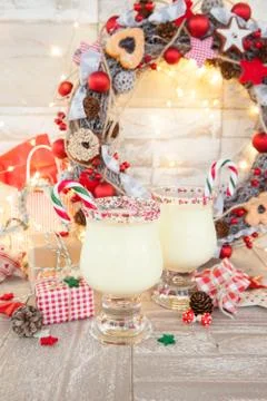 Egg nog with candy cane Stock Photos