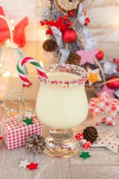Egg nog with candy cane Stock Photos