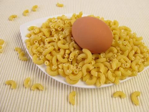 Egg noodles and an egg Stock Photos