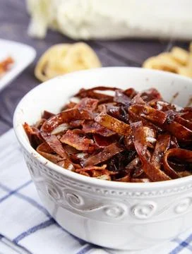 Egg noodles with bacon bits and Chinese cabbage Stock Photos