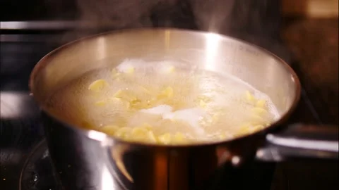 Egg noodles boiling in water time lapse close up Video stock 150990802