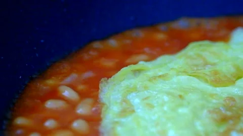 Egg omelet &amp; baked beans cooking 4 Stock Footage 41476878