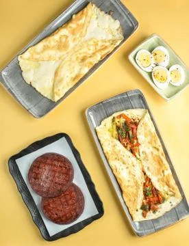 Egg omelette eggs in steep and fried sausage Stock Photos