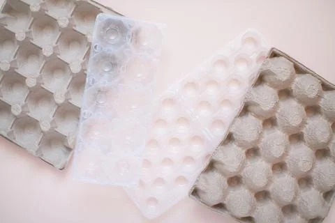 Egg packaging: recyclable and plastic. Waste sorting. Ecological problems Stock Photos