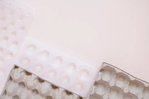 Egg packaging: recyclable and plastic. Waste sorting. Ecological problems Stock Photos