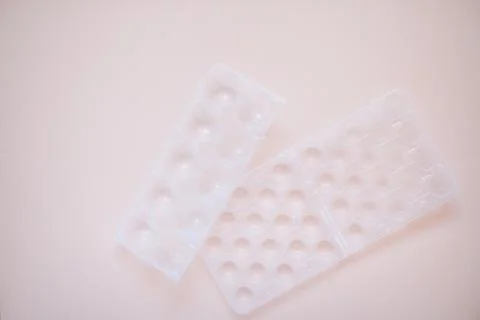 Egg packaging: recyclable and plastic. Waste sorting. Ecological problems Stock Photos