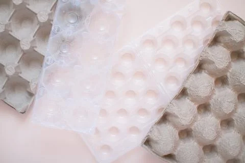 Egg packaging: recyclable and plastic. Waste sorting. Ecological problems Stock Photos