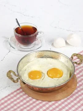 Egg in pan Stock Photos