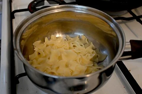 Egg pasta preparation in pot with raw eggs Fotos Stock