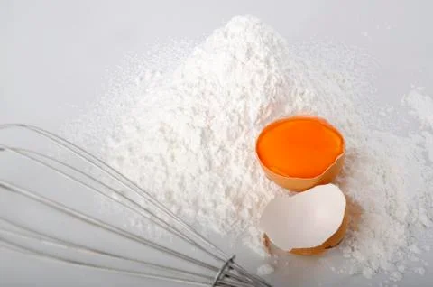 Egg pile in flour Stock Photos
