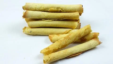 Egg roll biscuit isolated on white background. Biscuits served during Ramad.. Stock Photos