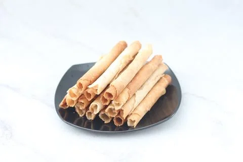 Egg roll or Semprong is snacks that normally serve on Hari Raya or Eid Al Fit Stock Photos