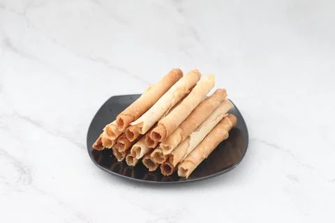 Egg roll or Semprong is snacks that normally serve on Hari Raya or Eid Al Fit Stock Photos
